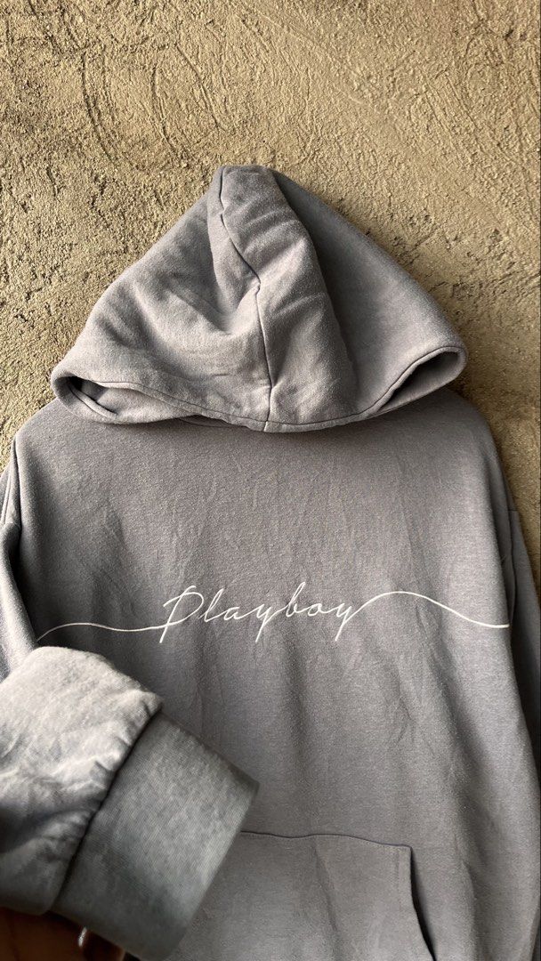 Playboy Grey Hoodie Size S/P (Category: Hoodies) located in Cabuyao City. Submitted by bulandos (Listing ID 1461428952, Image 3). Description: - Grey Playboy hoodie - Classic Playboy bunny logo on back - 'Playboy' text graphic on front - Kangaroo pocket - Hood with drawstrings - Made in China - Tagged S/P.