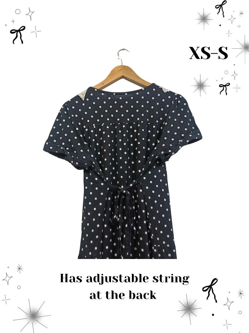 Polka Dot Dress with Lace Collar (Category: Dresses) located in Manila. Submitted by dear__riri__ (Listing ID 1461519680, Image 2). Description: - Adorable navy blue dress with classic white polka dots. - Features a charming lace collar and delicate lace trim at the hem. - Comfortable short sleeves. - Adjustable string tie at the back for a personalized fit. - Size: Fits XS to Small..