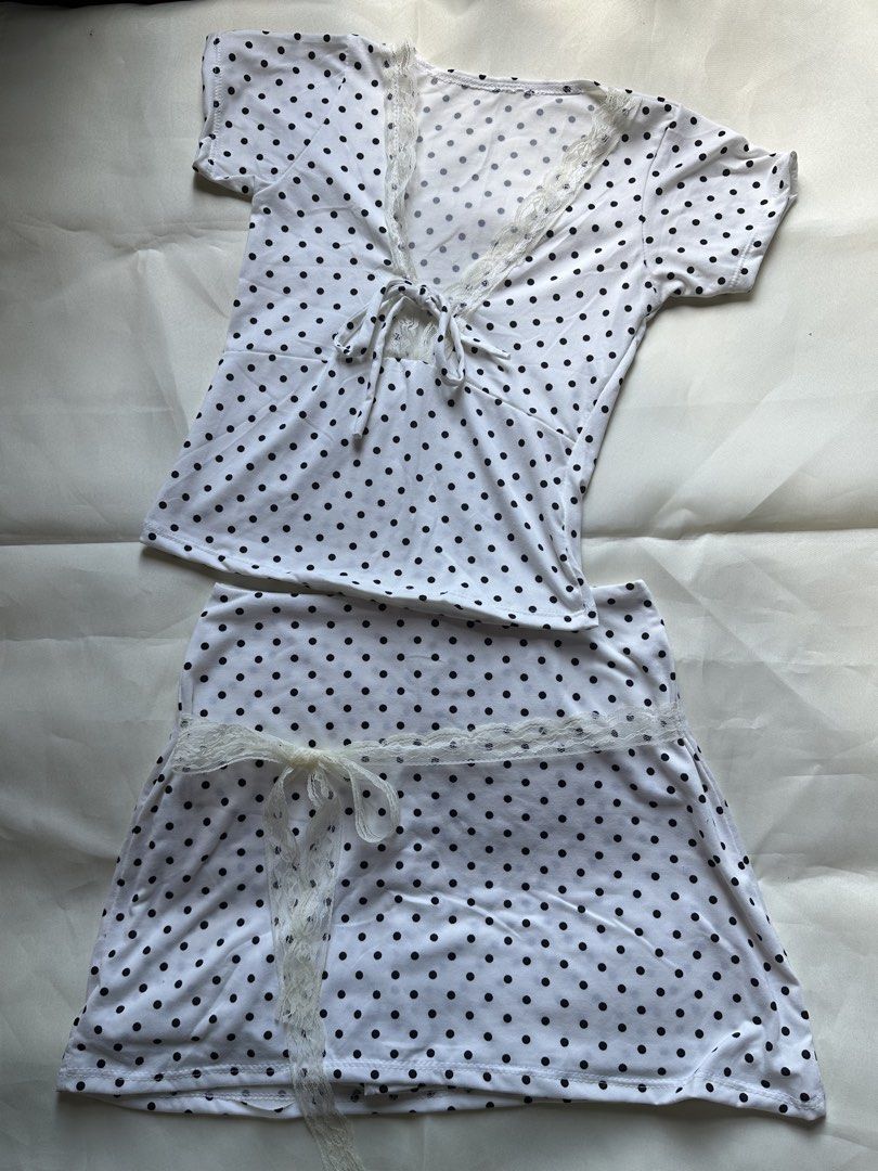 Polka Dot Pajama Set with Lace Trim - Multiple Colors (Category: Undergarments & Loungewear) located in Pasacao. Submitted by eommacollections_ (Listing ID 1461475619, Image 3). Description: - Comfy polka dot pajama set - Includes top and skirt - Features delicate lace trim and ribbon tie details - Available colors: Navy Blue, White, Maroon - Made from soft fabric, perfect for lounging at home.