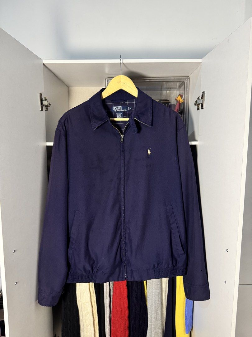 Polo Ralph Lauren Navy Harrington Jacket Size M (Category: Coats, Jackets and Outerwear) located in Tabaco. Submitted by emmanyul (Listing ID 1461328501, Image 1). Description: - Classic navy Polo Ralph Lauren Harrington jacket - Iconic embroidered polo player logo on chest - Material: Polyester shell, Cotton blend body lining - Size: Medium (M) - Versatile for casual wear or layering.