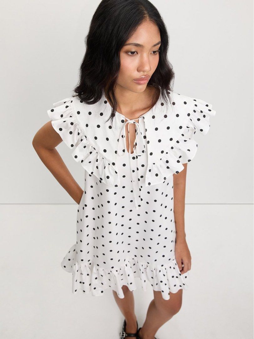 Pomelo polka dot ruffle trim dress (Category: Dresses) located in Makati City. Submitted by prelovedbystella16 (Listing ID 1461409372, Image 2). Description: Worn once only for art fair Good as new condition. Needs washing only. Stored in closet and has a bit make up stain only (can be removed during laundry) Size medium With side pockets .