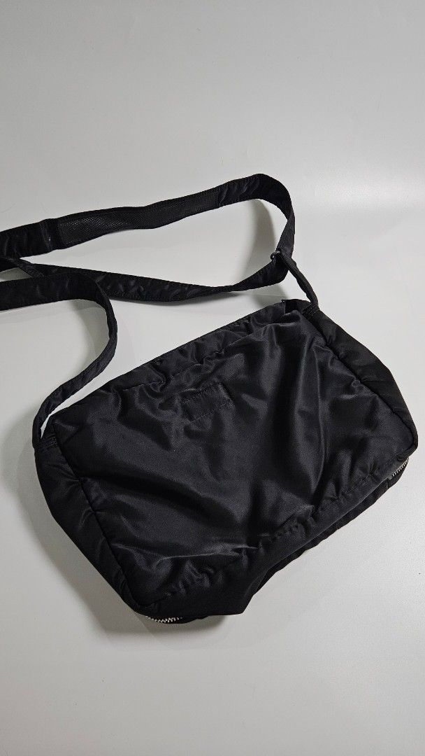 Porter Yoshida & Co. Tank Bag (Category: Sling Bags) located in Alfonso. Submitted by jbcamet (Listing ID 1461491496, Image 2). Description: - Durable black Porter shoulder bag - Made from tough nylon material - Multiple compartments for organized storage - Includes clear pockets and a main zippered section - Adjustable strap for comfortable carrying - Equipped with reliable YKK zippers - Ideal for everyday use or travel adventures.