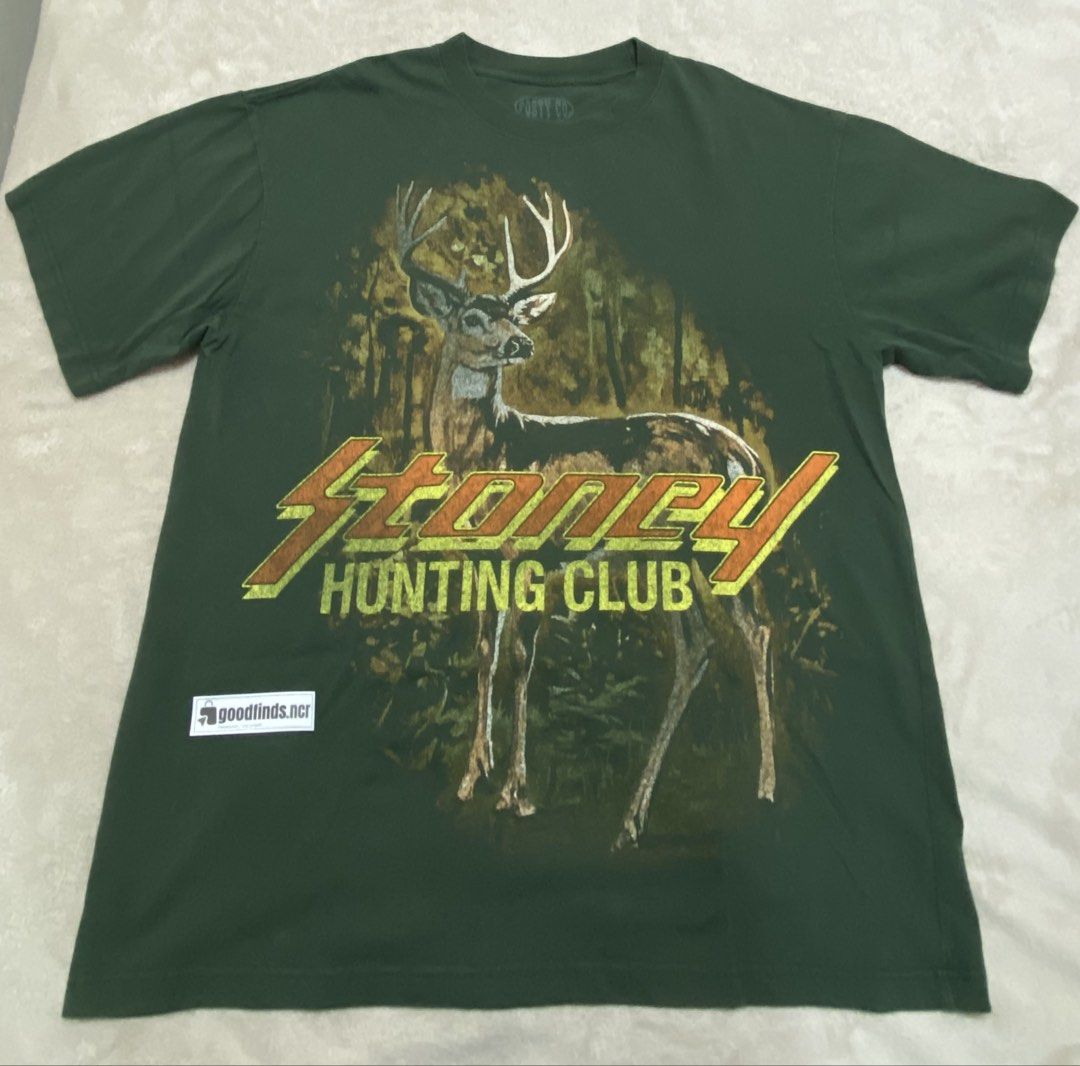 Post Malone's "Big Ass Stadium Tour" (Category: Looking For) located in Manila. Submitted by goodfinds.ncr (Listing ID 1461483257, Image 1). Description: Merchandise tee featuring a front "Stoney Hunting Club" buck/forest graphic and tour dates on the back, tagged on official POSTY CO. neck label (Size XL, 100% cotton, Made in China). Front: Vintage hunting-style deer graphic with bold "Stoney" retro-slant lettering. Back: "POST MALONE'S BIG ASS 
