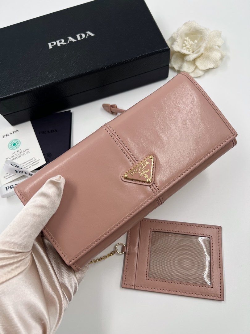 ⚜️Prada long wallet (Category: Luxury Accessories) located in Makati City. Submitted by 90sangel (Listing ID 1458086071, Image 2). Description: •Item: Prada Long leather wallet 🩷 •Condition: Gently Used, Good as new *this includes store box, cards. No paperbag included .