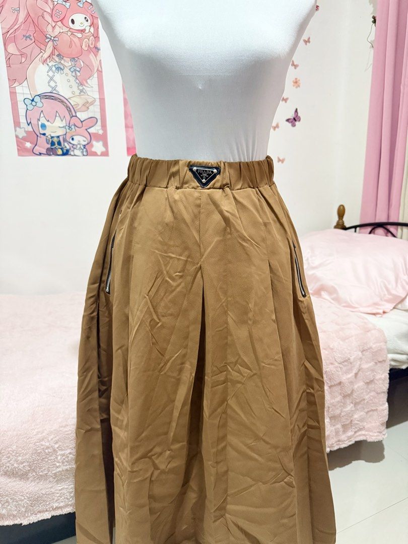 Prada Milano Brown skirt (Category: Skirts) located in Baguio. Submitted by yuridere (Listing ID 1461414865, Image 1). Description: waist: 28-30in length: 33in - Shipping fee shall be covered by buyer ! - MOP: Gcash, Bank Transfer or Cash (for meet up) - Item is newly washed! Can be worn after purchase ^__^ - DM for inquiries & more photo examples !.