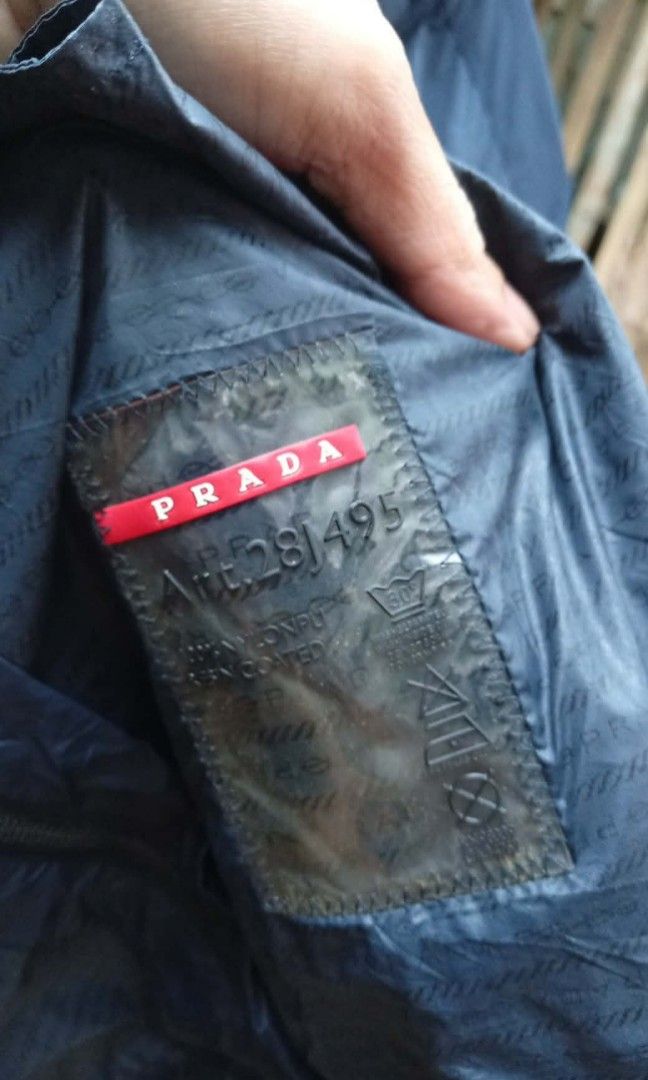 Prada Nylon Jacket Triangle Logo ( Authentic ) (Category: Coats, Jackets and Outerwear) located in Barotac Nuevo. Submitted by john.pritz (Listing ID 1461439831, Image 3). Description: Prada Nylon Jacket Triangle Logo ( Authentic ) as new condi no issue no runs no pinhole Size 52 on tag Width 23 Length 28.