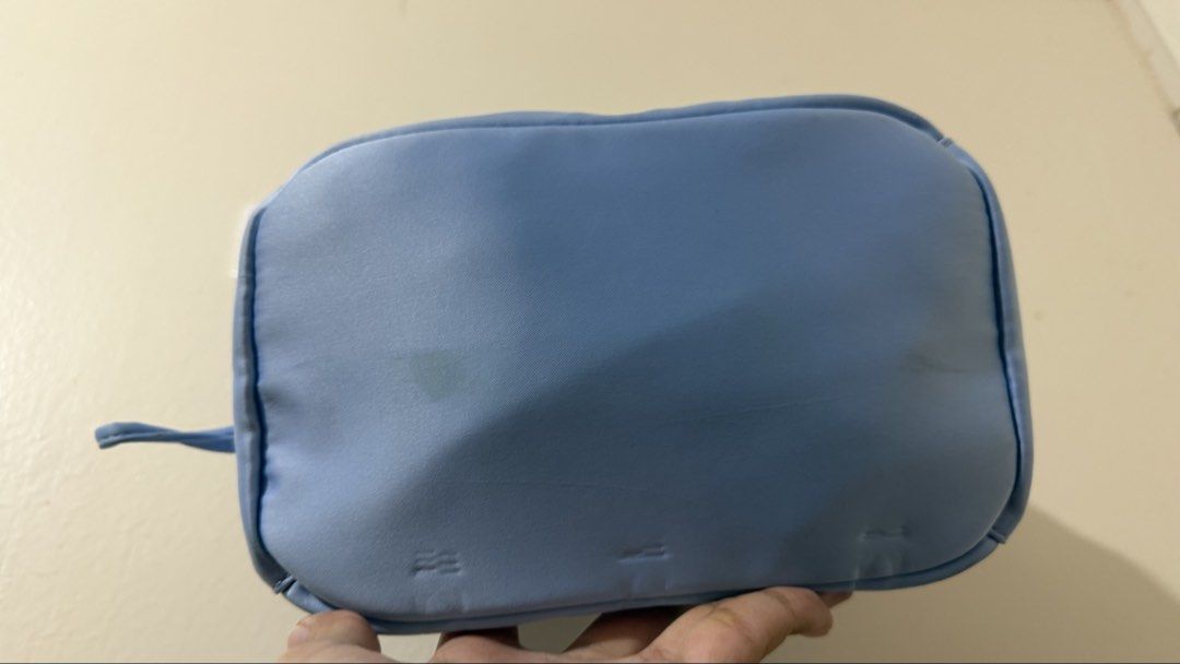 Prada Nylon Mini Bag Light Blue (Category: Purses & Pouches) located in Rizal. Submitted by lovegclothingph (Listing ID 1461479156, Image 3). Description: - Light blue Prada mini bag - Durable nylon material - Chic side drawstring detail - Comfortable handle for easy carrying - Ideal for your daily essentials - With minimal stains - No sling included - RFS: Decluttering.