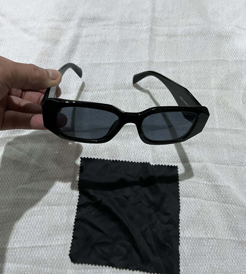 Prada PR2313 Sunglasses Black (Category: Sunglasses & Eyewear) located in Kabankalan. Submitted by miaangelar73343 (Listing ID 1461408933, Image 3). Description: Prada Sunglasses - Model: PR2313 - Frame Color: Black - Lens Color: Dark - Size: 54-20 145 - Includes: Soft Pouch & Cleaning Cloth - Ideal for everyday wear.