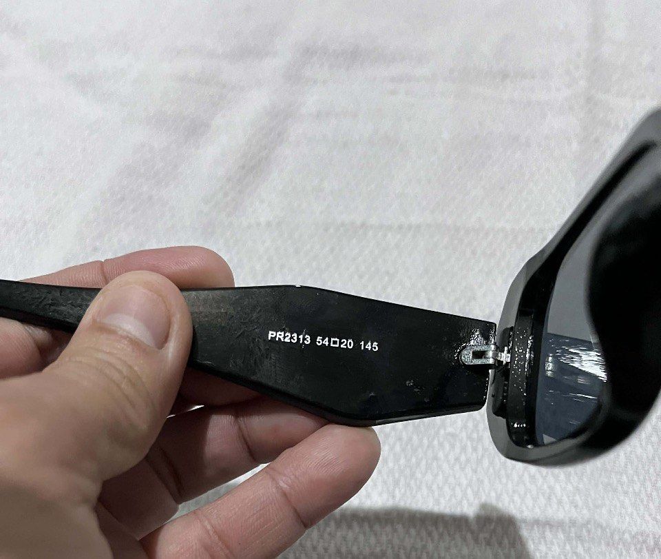 Prada PR2313 Sunglasses Black (Category: Sunglasses & Eyewear) located in Kabankalan. Submitted by miaangelar73343 (Listing ID 1461408933, Image 2). Description: Prada Sunglasses - Model: PR2313 - Frame Color: Black - Lens Color: Dark - Size: 54-20 145 - Includes: Soft Pouch & Cleaning Cloth - Ideal for everyday wear.
