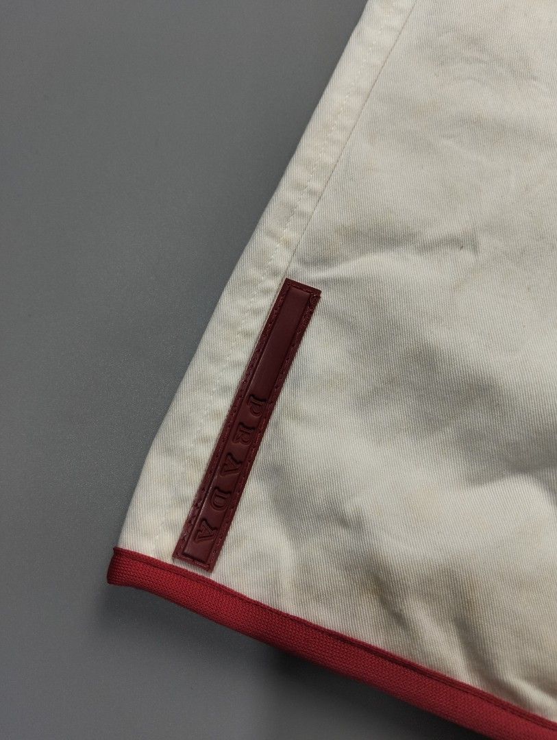 PRADA red tab skirt (Category: Luxury Apparel) located in Bulacan. Submitted by recycloth_ (Listing ID 1461324781, Image 2). Description: PRADA red tab skirt size on tag 40 waistline: 28 length: 17" yellow stain flaws hmu!.