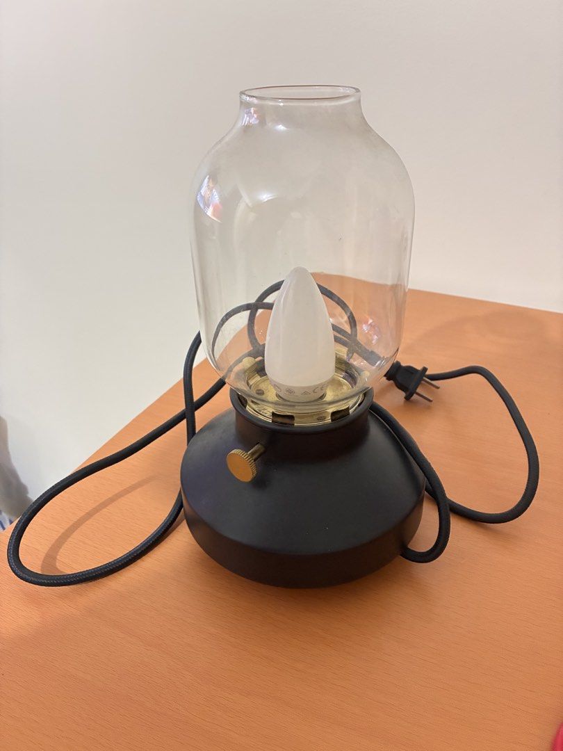 Preloved Tarnaby Table Lamp (Category: Lighting) located in Pasig City. Submitted by dinpauline (Listing ID 1461459640, Image 1). Description: Details: * Original price: ₱1,299 * Color: Anthracite / Black * Size: 25 cm (10”) * Dimmable * Warm, cozy lighting — perfect for bedroom, living room, desk, or bedside table * Glass shade with stylish vintage-inspired design ✅ Preloved and well-maintained 📦 RFS: No longer needed 📍 Meetup/Location: Urban 