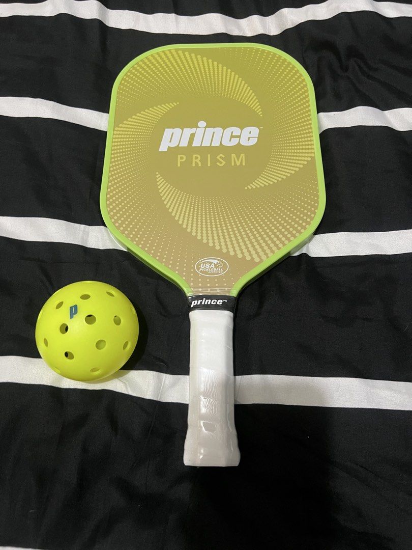 Prince Prism Pickleball Paddle and Ball Set (Category: Racket and Ball Sports) located in Pasig City. Submitted by alon02 (Listing ID 1461348558, Image 1). Description: - Prince Prism pickleball paddle - Includes one pickleball - Ideal for playing pickleball - Available colors: Lime Green or Blue - Perfect for personal use or as a gift - Feel free to ask any questions!.