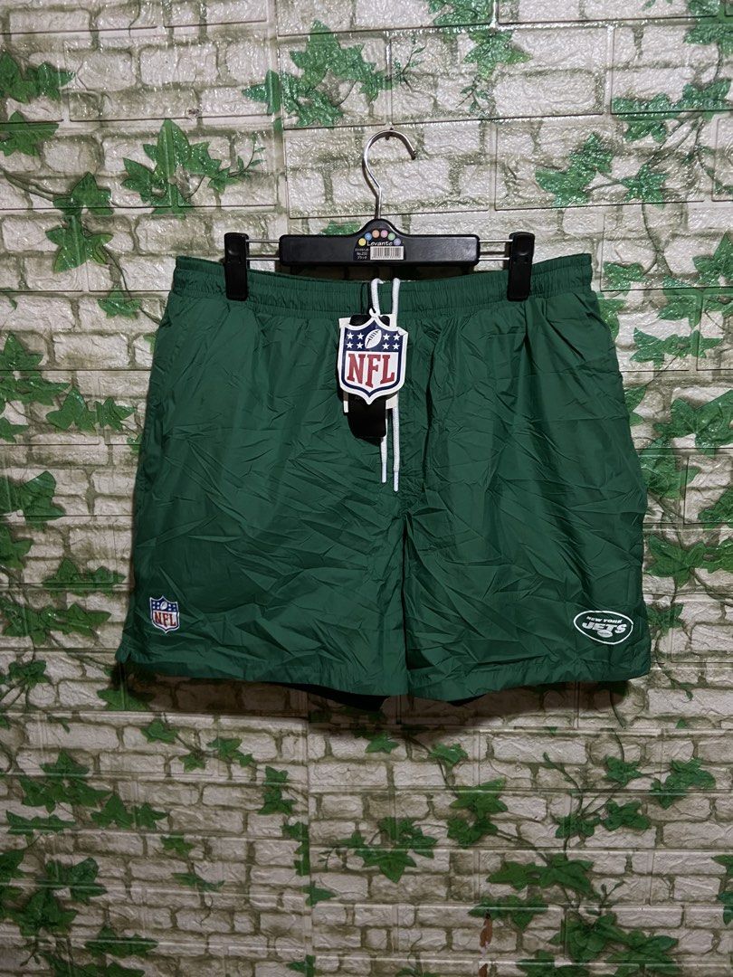 Pull & Bear NFL New York Jets Green Shorts (Category: Shorts) located in Davao. Submitted by mengsmixitems (Listing ID 1461340418, Image 1). Description: - Brand: Pull & Bear - Color: Green - Design: Features New York Jets NFL logo on the leg - Fit: Drawstring waist for adjustable comfort - Usage: Ideal for casual wear or sports activities - Style: Team apparel shorts.