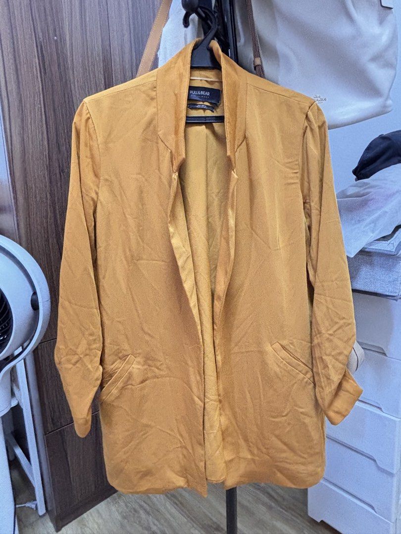 PULL&BEAR Outerwear Mustard Yellow Blazer (Category: Coats, Jackets and Outerwear) located in Quezon City. Submitted by frodo0905 (Listing ID 1461445884, Image 1). Description: - Mustard yellow blazer from PULL&BEAR - Open front with lapel collar - Three-quarter sleeves - Two front pockets - Made in Morocco - Ideal for layering over tops or dresses.
