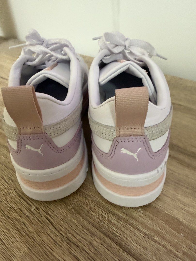 Puma White & Pink Platform Sneakers (Category: Sneakers) located in Pasig City. Submitted by jenrosesteller (Listing ID 1461501302, Image 3). Description: - White Puma sneakers - Pink and grey accents - Platform sole for added height - Lace-up closure - Heel pull tab for easy wear - Ideal for casual outfits - Size: 39 EUR / 6 UK / 8.5 US - No box, bought in HK (bought 3 pcs) impulsive buying due to discount :/ .