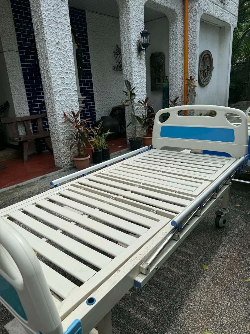 Push button Adjustable Hospital Bed with Wheels (Category: Medical Supplies & Tools) located in Caloocan City. Submitted by vastgem_7063b1 (Listing ID 1461396810, Image 3). Description: - Adjustable hospital bed - Features wheels for easy mobility - Sturdy metal frame with blue and white accents - Ideal for home care or medical facilities - Ready for pickup.