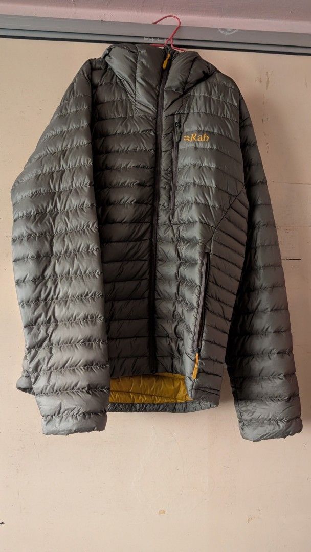 Rab Microlight Alpine Down Jacket (Category: Hiking & Camping) located in Singapore. Submitted by lens.and.bars (Listing ID 1461348840, Image 1). Description: Size US/UK M, Japan L Light khaki (Olive) colour RFS: In need of upgrade warm enough for casual town wear/resting in base camp.