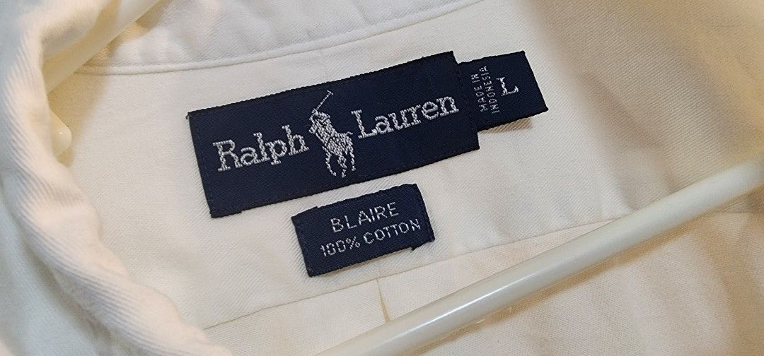 Ralph Lauren "Blaire" Button Down Shirt - Size L (Category: Tshirts & Polo Shirts ) located in Makati City. Submitted by culori1.8 (Listing ID 1461476431, Image 2). Description: - Classic white Ralph Lauren button-down shirt - 100% premium cotton fabric - Iconic embroidered polo player logo on chest - Tagged size L - Versatile for casual and smart-casual outfits - Effortless to style.