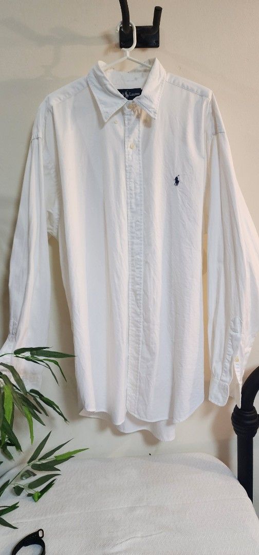 Ralph Lauren "Blaire" Button Down Shirt - Size L (Category: Tshirts & Polo Shirts ) located in Makati City. Submitted by culori1.8 (Listing ID 1461476431, Image 1). Description: - Classic white Ralph Lauren button-down shirt - 100% premium cotton fabric - Iconic embroidered polo player logo on chest - Tagged size L - Versatile for casual and smart-casual outfits - Effortless to style.