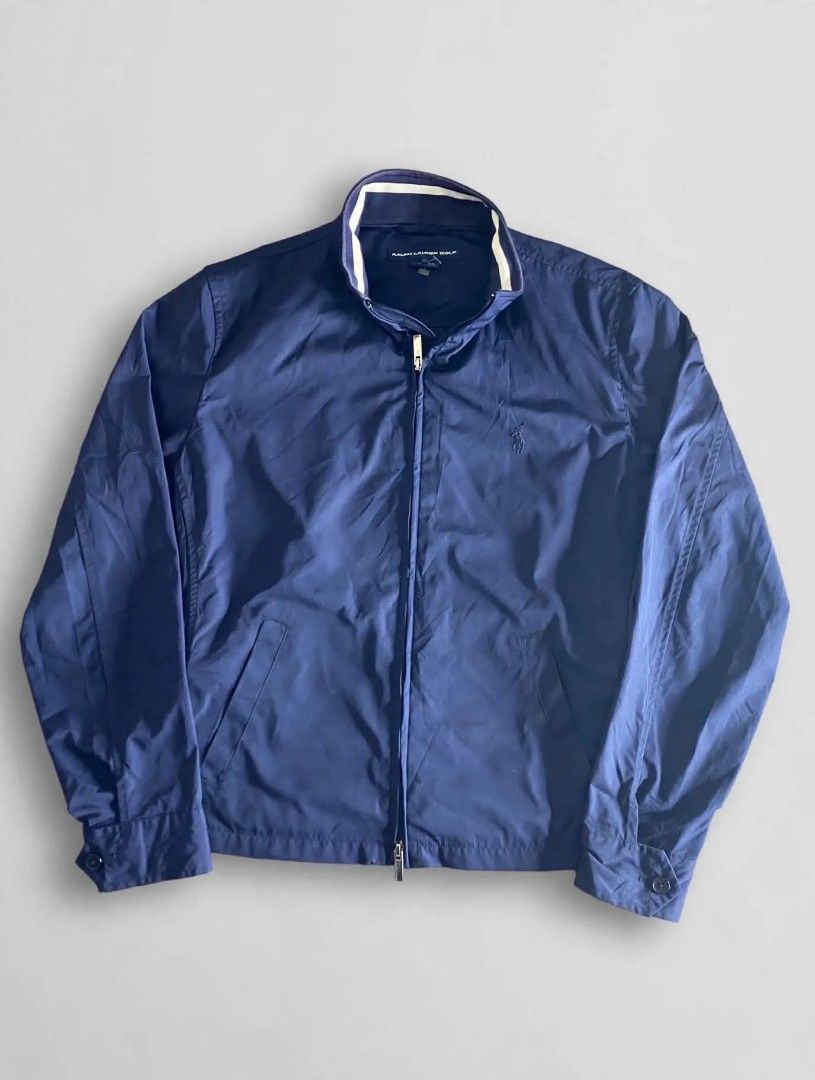 Ralph Lauren Golf Navy Blue Zip-Up Jacket (Category: Coats, Jackets and Outerwear) located in Bansalan. Submitted by thriftyzzz (Listing ID 1461473689, Image 1). Description: - Navy blue Ralph Lauren Golf jacket - Full zip closure - Front pockets - Adjustable waist straps - Ribbed collar detail - Ideal for layering or light weather - Easy to pack and wear.