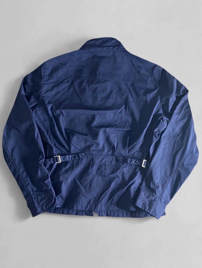 Ralph Lauren Golf Navy Blue Zip-Up Jacket (Category: Coats, Jackets and Outerwear) located in Bansalan. Submitted by thriftyzzz (Listing ID 1461473689, Image 2). Description: - Navy blue Ralph Lauren Golf jacket - Full zip closure - Front pockets - Adjustable waist straps - Ribbed collar detail - Ideal for layering or light weather - Easy to pack and wear.