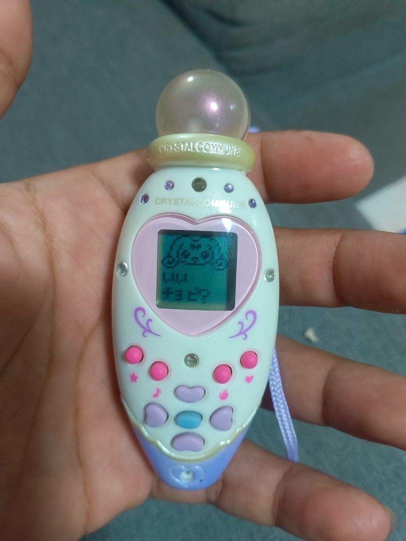 Rare Precure Crystal Commune BANDAI (Category: Designer & Blind Box Toys) located in Manila. Submitted by mateochest99469 (Listing ID 1461460139, Image 3). Description: Selling a highly sought-after vintage anime magical girl transformation item/virtual pet from the 2006 franchise Futari wa Pretty Cure Splash Star.This set is incredibly rare to find alongside its dedicated matching fabric carrier pouch! ✨ What’s Included:Crystal Commune Main Unit