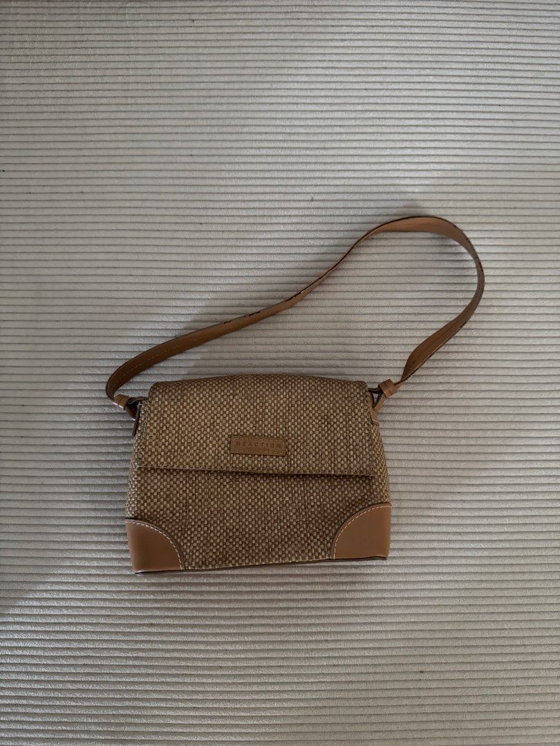Reaction Kenneth Cole Woven Shoulder Bag (Category: Shoulder Bags) located in Pasig City. Submitted by justinebernabe_ (Listing ID 1461380839, Image 1). Description: - Cute woven shoulder bag from Reaction Kenneth Cole. - Tan and brown woven material with tan leather trim. - Adjustable strap for comfortable wear. - Ideal for everyday use and carrying your essentials..
