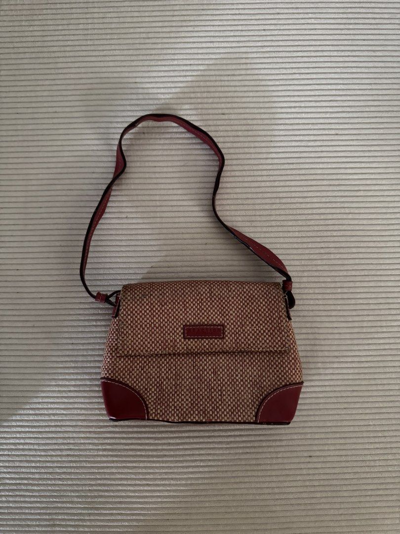 Reaction Kenneth Cole Woven Shoulder Bag (Category: Shoulder Bags) located in Pasig City. Submitted by justinebernabe_ (Listing ID 1461380839, Image 2). Description: - Cute woven shoulder bag from Reaction Kenneth Cole. - Tan and brown woven material with tan leather trim. - Adjustable strap for comfortable wear. - Ideal for everyday use and carrying your essentials..