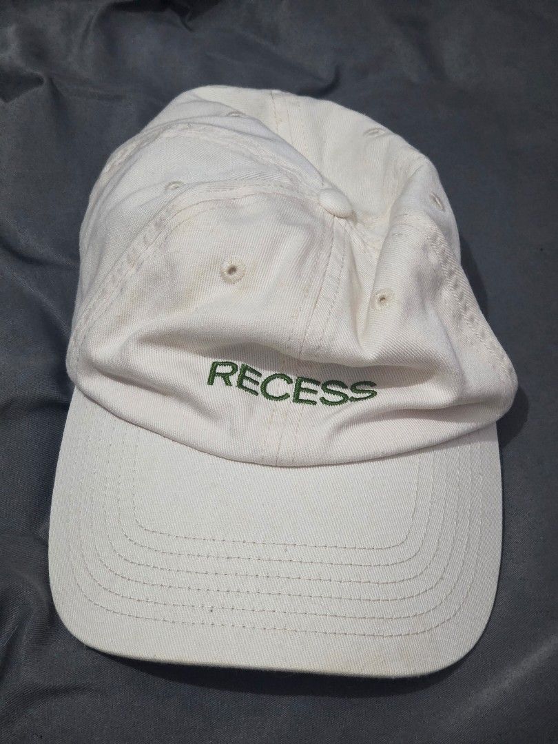 Recess Embroidered Cap (Category: Activewear) located in Santa Rosa. Submitted by prelovvdd (Listing ID 1461370022, Image 1). Description: - Classic cream-colored baseball cap - Features 'RECESS' embroidered in green on the front - Simple and timeless design - Adjustable strap at the back for a comfortable, customized fit - Ideal for everyday casual wear.