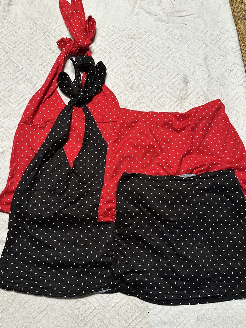 Red & Black Polka Dot Halter Dress Set (Category: Dresses) located in Pasacao. Submitted by eommacollections_ (Listing ID 1461475310, Image 2). Description: - Set includes two polka dot halter dresses. - One red dress with a flared skirt. - One black dress with a fitted skirt. - Both dresses feature a halter neck with a tie-back closure. - Ideal for summer wear or achieving a retro look. - Easy to style and wear..
