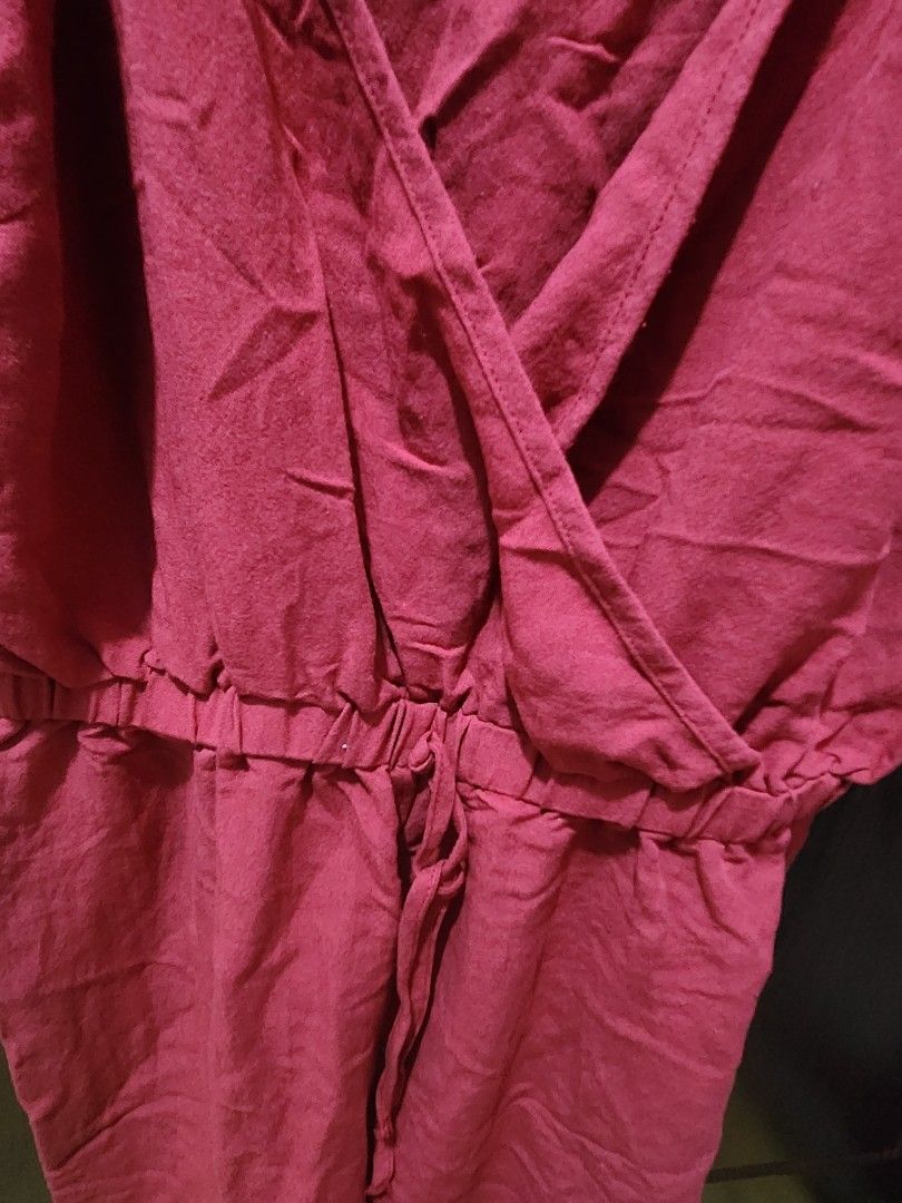Red Wrap V-Neck jumpsuit (Category: Dresses) located in Muntinlupa City. Submitted by yanyan1888 (Listing ID 1461367994, Image 3). Description: - Flattering red wrap jumpsuit with V-neckline - Adjustable straps for a customized fit - Tie waist detail creates a cinched, flattering silhouette - Comfortable material, likely linen or a blend - Versatile: great for casual outings or as a stylish beach cover-up - Easy to wear and style for effortless f