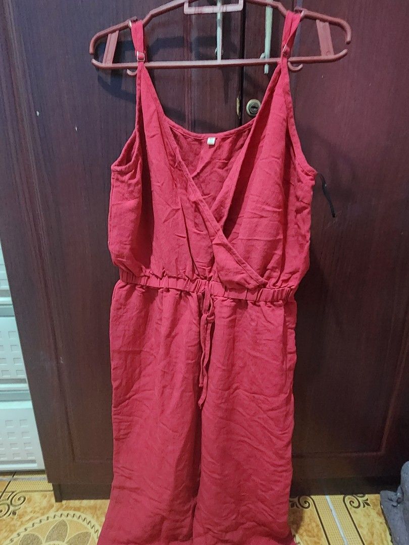Red Wrap V-Neck jumpsuit (Category: Dresses) located in Muntinlupa City. Submitted by yanyan1888 (Listing ID 1461367994, Image 1). Description: - Flattering red wrap jumpsuit with V-neckline - Adjustable straps for a customized fit - Tie waist detail creates a cinched, flattering silhouette - Comfortable material, likely linen or a blend - Versatile: great for casual outings or as a stylish beach cover-up - Easy to wear and style for effortless f