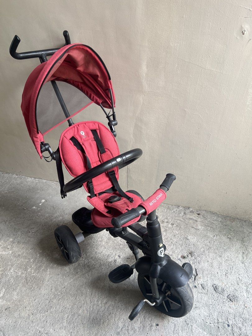 Rito Star Red Tricycle with Canopy (Category: Strollers) located in Quezon City. Submitted by fatcatgang (Listing ID 1461364463, Image 1). Description: Red Rito Star foldable tricycle with a canopy for sun protection. Bought in Toys R Us for 7599php in 2023. Has a parent handle for steering. Safety harness included. Footrests are present. Some signs of wear on the seat and storage basket. Wheels are black. Great for outdoor fun. Good functional c
