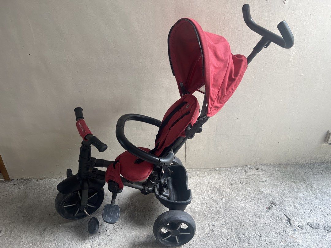 Rito Star Red Tricycle with Canopy (Category: Strollers) located in Quezon City. Submitted by fatcatgang (Listing ID 1461364463, Image 2). Description: Red Rito Star foldable tricycle with a canopy for sun protection. Bought in Toys R Us for 7599php in 2023. Has a parent handle for steering. Safety harness included. Footrests are present. Some signs of wear on the seat and storage basket. Wheels are black. Great for outdoor fun. Good functional c