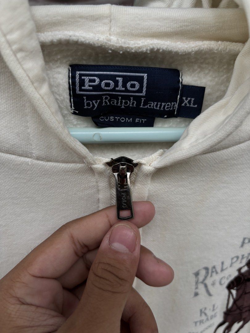 RL Hoodie (Category: Coats, Jackets and Outerwear) located in Isulan. Submitted by nur_thrifts (Listing ID 1461335036, Image 3). Description: RL hoodie Condition: 9/10 Dimes: 21x26 Xl on tag Youth Size 850+ship (nego) Good condition Small stain not noticeable Cut wash tags 📍Isulan, SK Comment/DM to claim”.