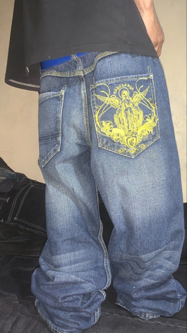 ROCAWEAR (EMBROIDERED DESIGN) (Category: Jeans) located in Aloran. Submitted by archives_wear (Listing ID 1461376828, Image 1). Description: ISSUE NASA PICS WAIST 34 THIGH 13.5 LENGTH 45 LEG OPENING 9.5 PRICE 1300.