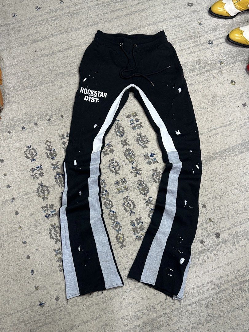 Rockstar Original Black Stacked Track Pants (Category: Other Bottoms) located in Daet. Submitted by thrifthings2018 (Listing ID 1461406801, Image 3). Description: - Brand: Rockstar Dist. - Color: Black - Style: Stacked Track Pants - Waistline: Fits 26-30 inches - Length: 46 inches - Details: White paint splatters, grey stripe down legs - Perfect for: Casual wear.