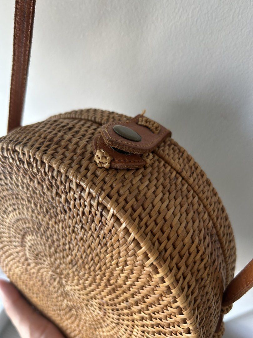 Round Rattan Bag with Leather Strap (Category: Cross-body Bags) located in Quezon City. Submitted by hygge.elements (Listing ID 1461345309, Image 3). Description: - Cute round rattan bag - Natural woven material - Brown leather strap and closure - Lined with blue and orange floral fabric - Ideal for beach trips or casual outings - Unique boho style.
