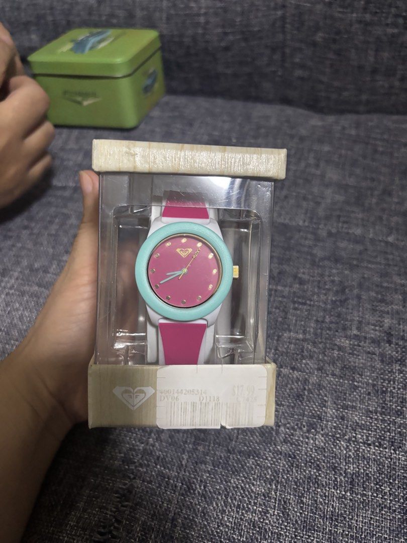 Roxy Watch - Pink, Teal, White (Category: Women's Watches) located in Famy. Submitted by frenchmacaroon (Listing ID 1461366044, Image 1). Description: - Authentic Roxy watch - Features a vibrant pink face - Stylish teal bezel - Comfortable white strap - Comes in original packaging - Includes the watch manual - Ideal for everyday wear - Makes a great gift.