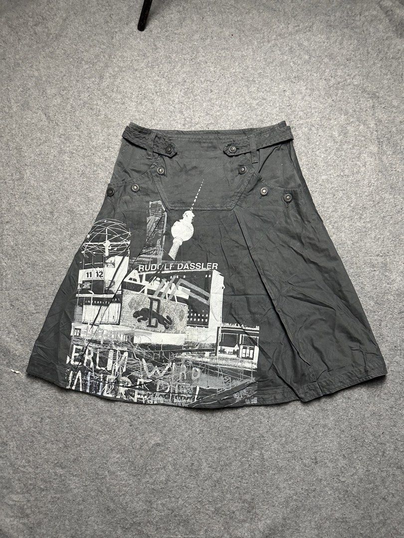 Rudolf Dassler Schuhfabrik / PUMA Spring summer 2003 (Category: Luxury Apparel) located in Zamboanga. Submitted by swayporgypretz (Listing ID 1461525450, Image 1). Description: Brand: Rudolf Dassler Schuhfabrik / PUMA • Made in: Italy • Material: 100% cotton • Size: XS • Line: Rudolf Dassler Schuhfabrik, the premium fashion-oriented PUMA line Era: most likely early–mid 2000s, approximately 2002–2007 • Design: military/cargo-inspired skirt with a 