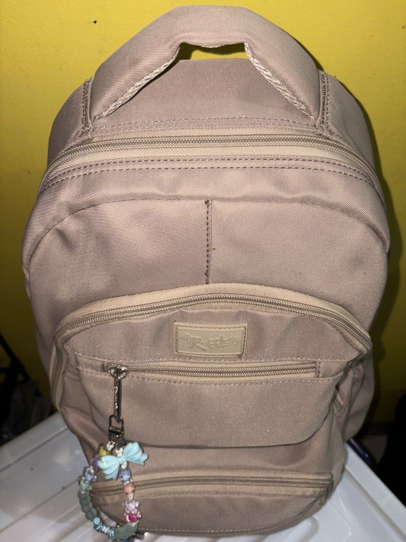 Ruffles Backpack with Charms ad ons (Category: Backpacks) located in Manila. Submitted by cleverwater2528 (Listing ID 1461482532, Image 3). Description: - Tan Ruffles backpack - Multiple pockets for excellent organization - Comes with cute beaded charms add ons - Ideal for school or everyday use - Zippers are in great working condition - Plenty of interior space PRICE IS STILL NEGOTIABLE.