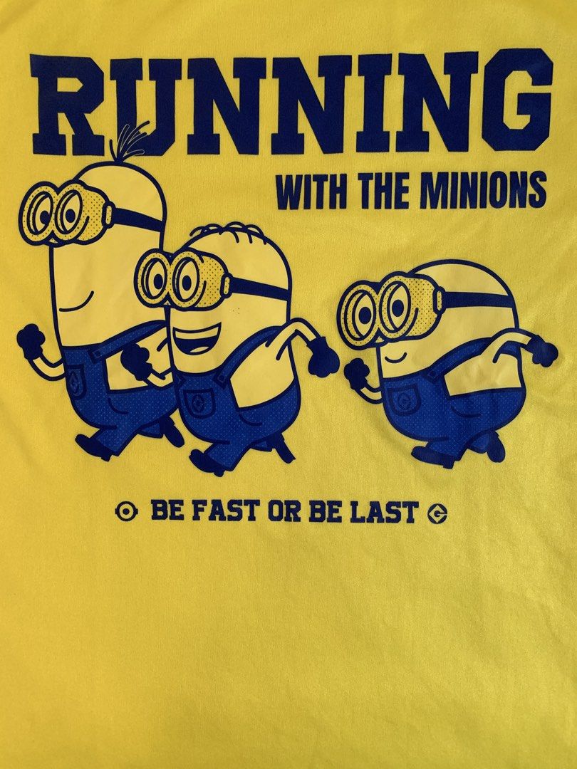Running with the Minion Run (Category: Activewear) located in Taguig. Submitted by ahnjr (Listing ID 1461430711, Image 1). Description: - Product: "Running with the Minion Run" T-shirt - Size: S (EU 48/UK 38/US 38) - Color: Yellow - Design: Features "Running with the Minions" graphic and "Be Fast or Be Last" slogan on the front. - Event Detail: "Minions Run 2025 Philippines" printed on the back. - Meetup Location: Vista Mall Taguig, Cayetano Blvd