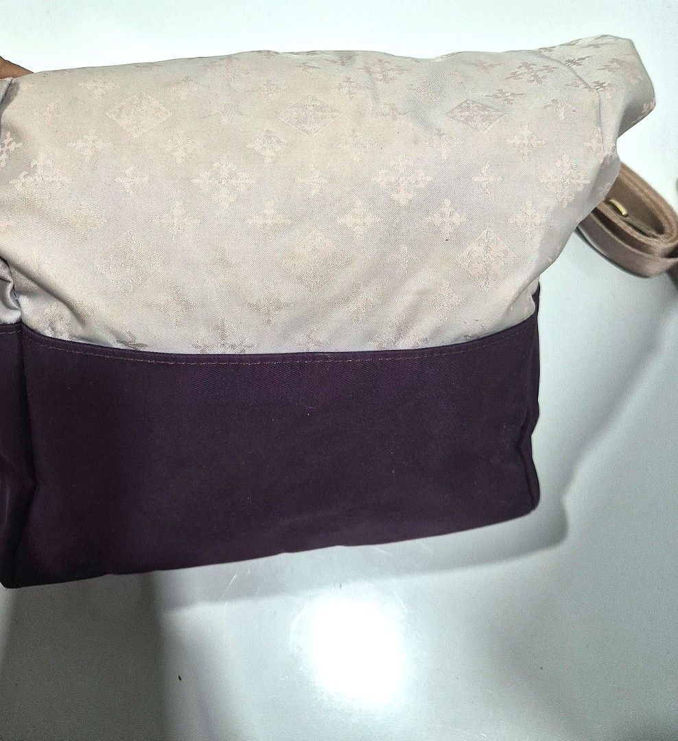 Russet Candle 2-way tote bag (Category: Luxury Bags & Wallets) located in Antipolo. Submitted by saribymonica (Listing ID 1461494071, Image 3). Description: -Russet Candle 2-way tote bag featuring a light monogram upper section and a contrasting dark purple base. - Light purple tote bag - Dark purple base - Subtle patterned fabric on upper part - Gold-tone hardware on straps - Detachable shoulder strap included - Interior zippered pocket - Clean 