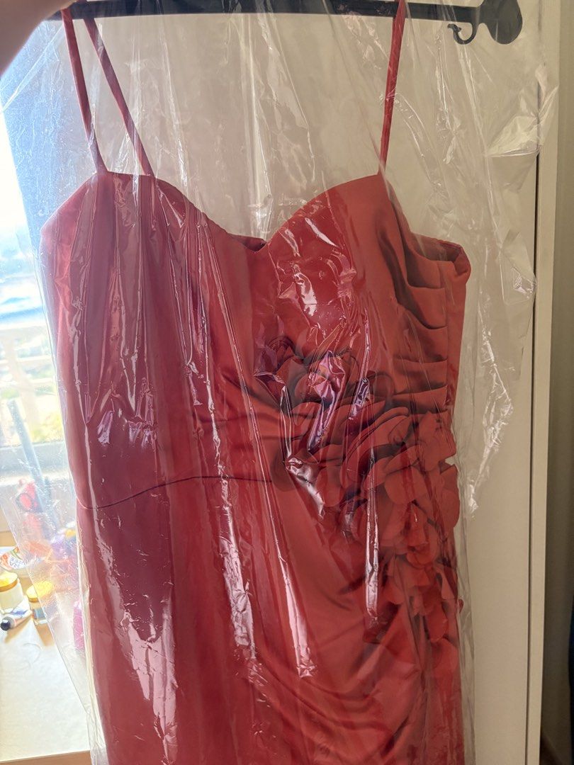 Rust Orange Bridesmaid Dress (Category: Dresses) located in Pasig City. Submitted by dcvirata (Listing ID 1461377982, Image 2). Description: - Rust orange gown - Sweetheart neckline & spaghetti straps - Can hide the spaghetti straps for tube dress (see last two photos) - With leg slit - Worn once for a wedding.