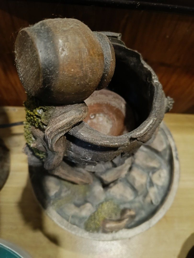 Rustic Tabletop Water Fountain (Category: Other Home Decor) located in Manila. Submitted by mecaart (Listing ID 1461411320, Image 3). Description: - Rustic broken pot design - Water flows down layers - Decorated with stones and mossy accents - Unique piece for home or garden - Adds a calming ambiance.