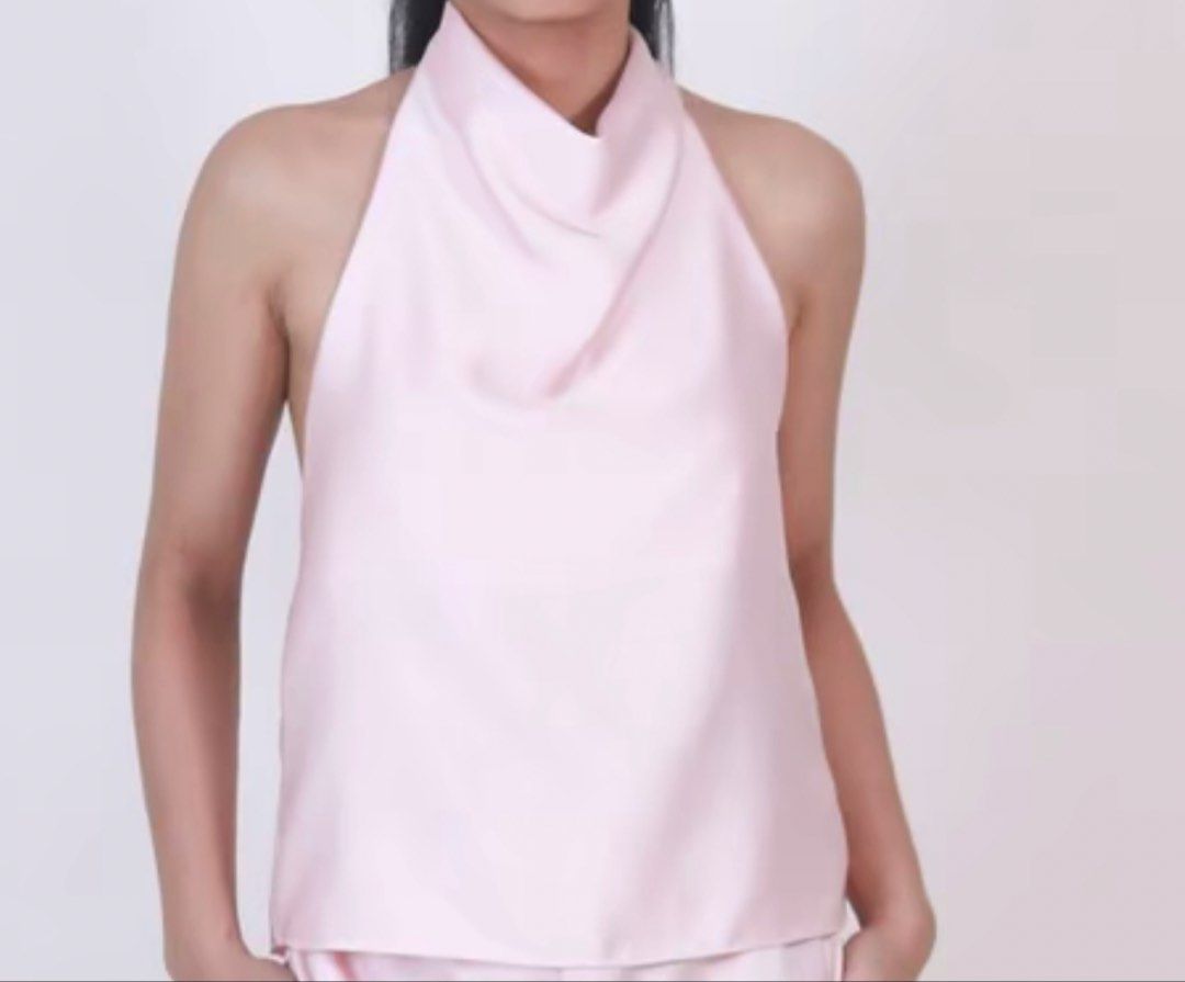 S Pink Satin Cowl Neck Halter Top (Category: Sleeveless) located in Makati City. Submitted by cooldragon_2d8241 (Listing ID 1461435029, Image 1). Description: - Soft pink satin halter top - Elegant draped cowl neckline - Sleeveless design - Flattering cut - Versatile: pairs well with skirts or pants - Ideal for night outs or special occasions - Comfortable and chic.