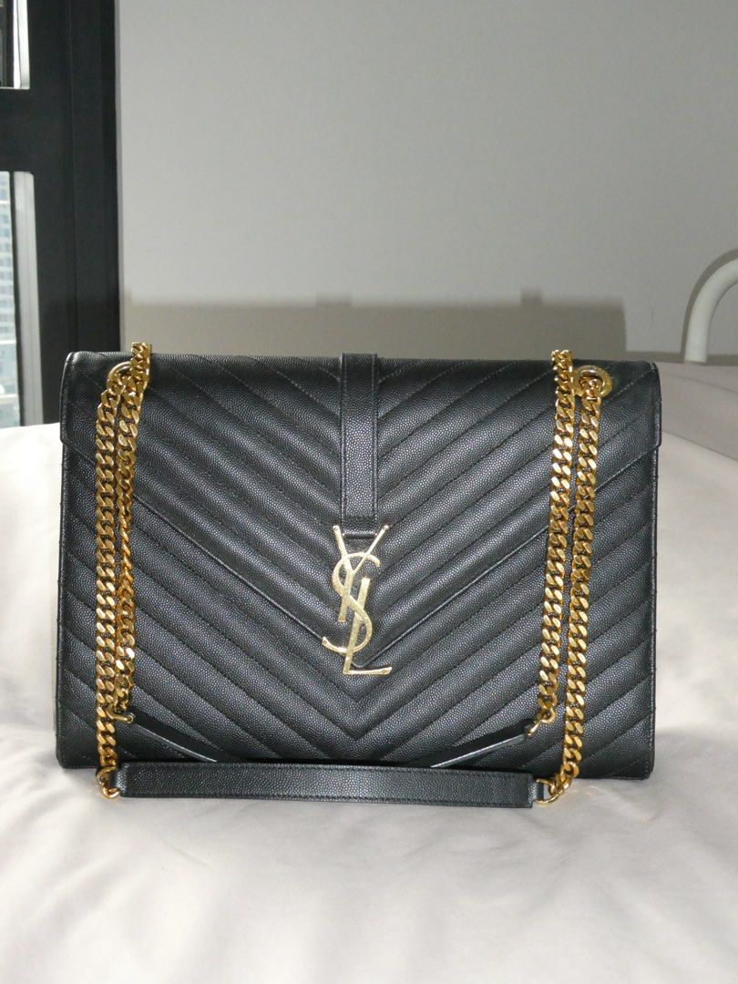 Saint Laurent Black Envelope Leather Chain Bag (Category: Luxury Bags & Wallets) located in Quezon City. Submitted by shopwithfrance (Listing ID 1461551168, Image 3). Description: - Authentic black leather YSL bag -like new - with paperbag, dustbag, copy of receipt.