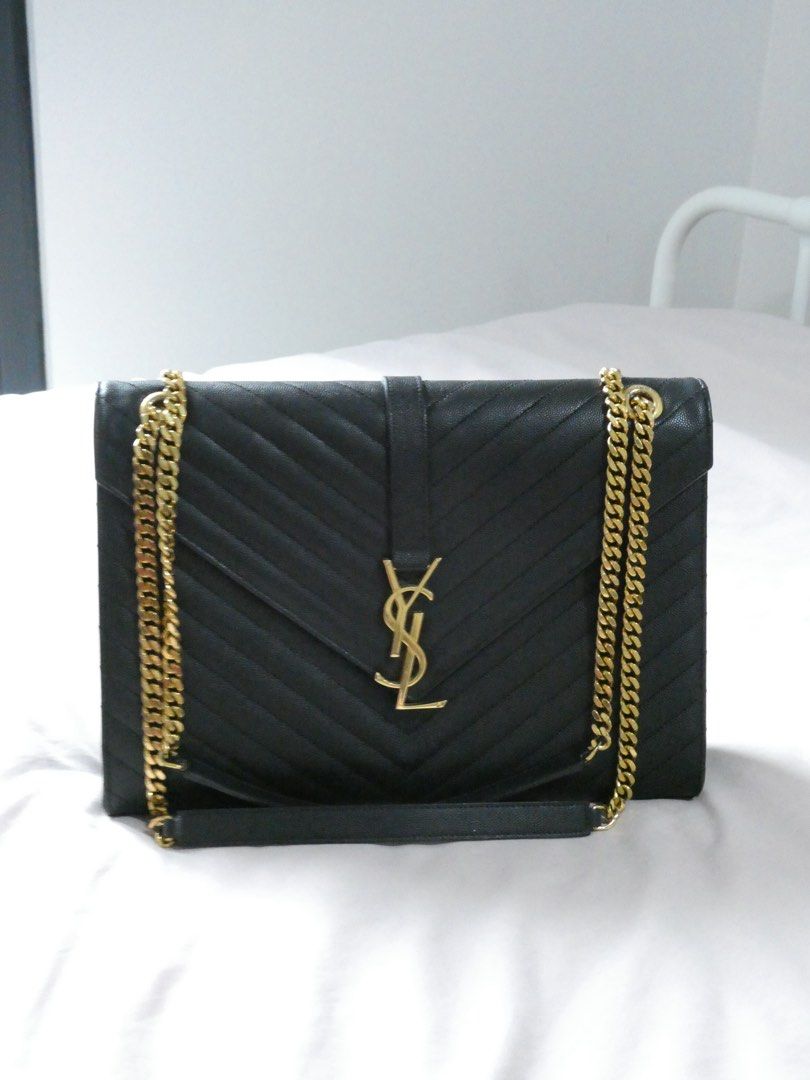 Saint Laurent Black Envelope Leather Chain Bag (Category: Luxury Bags & Wallets) located in Quezon City. Submitted by shopwithfrance (Listing ID 1461551168, Image 2). Description: - Authentic black leather YSL bag -like new - with paperbag, dustbag, copy of receipt.