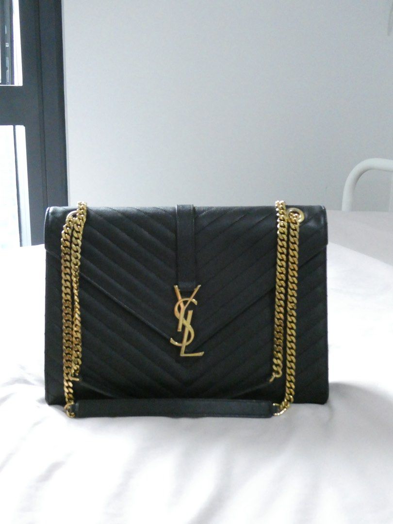 Saint Laurent Black Envelope Leather Chain Bag (Category: Luxury Bags & Wallets) located in Quezon City. Submitted by shopwithfrance (Listing ID 1461551168, Image 1). Description: - Authentic black leather YSL bag -like new - with paperbag, dustbag, copy of receipt.