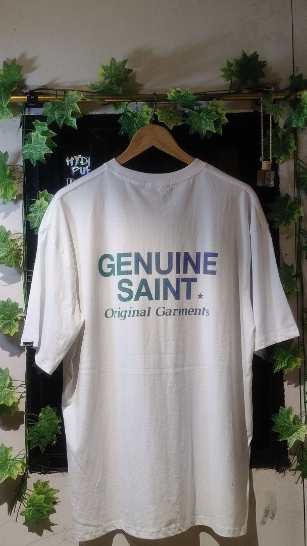 SAINT Original Garments T-shirt White (Category: Tshirts & Polo Shirts ) located in Manila. Submitted by moneyroll420 (Listing ID 1461473885, Image 2). Description: - Classic white t-shirt - Features 'SAINT' logo on the front - 'GENUINE SAINT Original Garments' graphic on the back - Comfortable and casual design - Ideal for everyday wear.